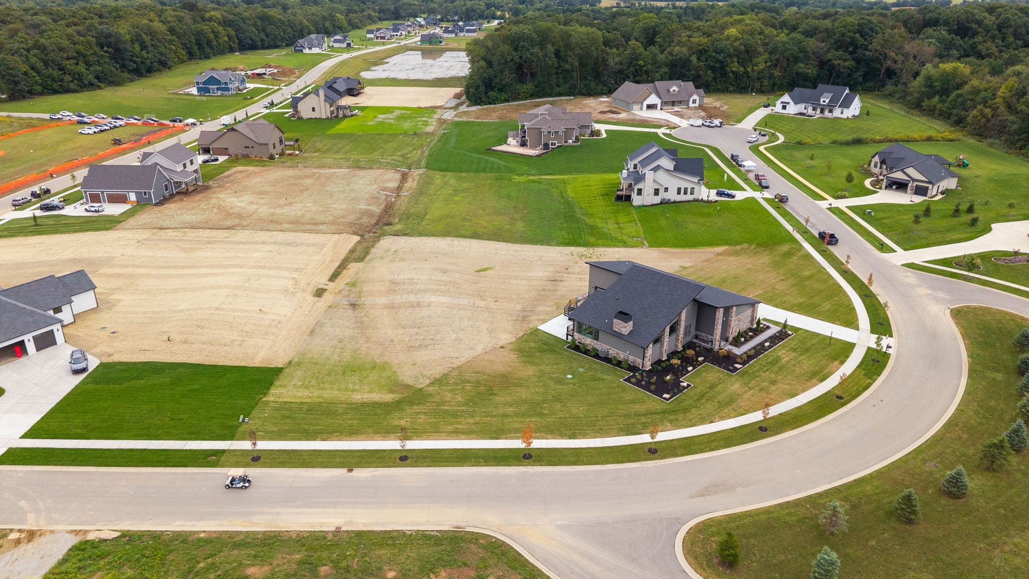 Aerial view of residential subdivision with Harvey custom home